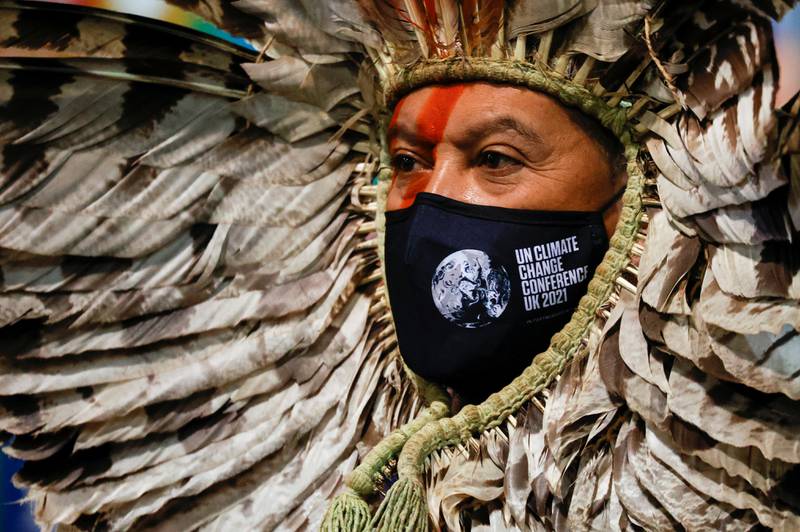 Indigenous Amazon delegate Romancil Gentil Kreta wears a Cop26 branded face mask. Reuters