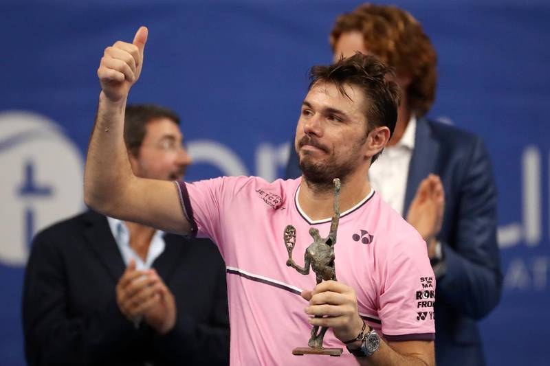 Stan Wawrinka of Switzerland gestures after receiving his second placed trophy at the European Open final tennis match in Antwerp, Belgium, Sunday, Oct. 20, 2019. Andy Murray of Britain defeated Wawrinka 3-6/6-4/6-4. (AP Photo/Francisco Seco)