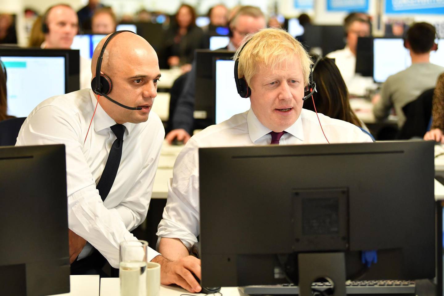 ***Getty European BestPix*** LONDON, UNITED KINGDOM - DECEMBER 8: Britain's Chancellor of the Exchequer Sajid Javid (L) and Britain's Prime Minister Boris Johnson (R) man the phones at the Conservative Campaign Headquarters Call Centre on December 8, 2019 in central London. Britain will go to the polls on December 12, 2019 to vote in a pre-Christmas general election. (Photo by Ben Stansall - WPA Pool/Getty Images)