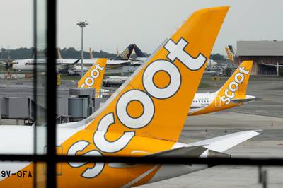 Scoot and Singapore Airlines planes sit on the tarmac, as airlines reduce flights following the outbreak of the coronavirus disease (COVID-19), at Singapore's Changi Airport. Reuters