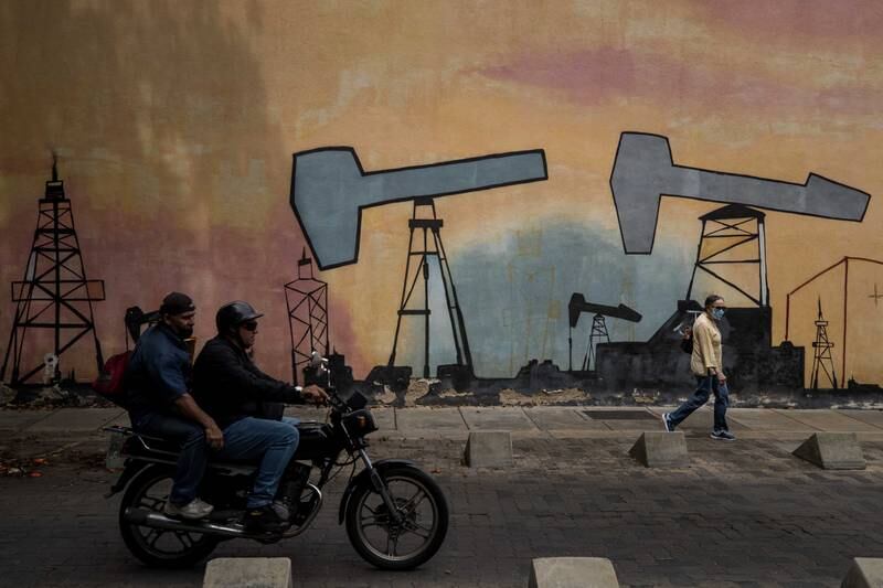Murals with designs alluding to oil companies outside one of the buildings of the state-owned company Petroleos de Venezuela in Caracas last week. EPA