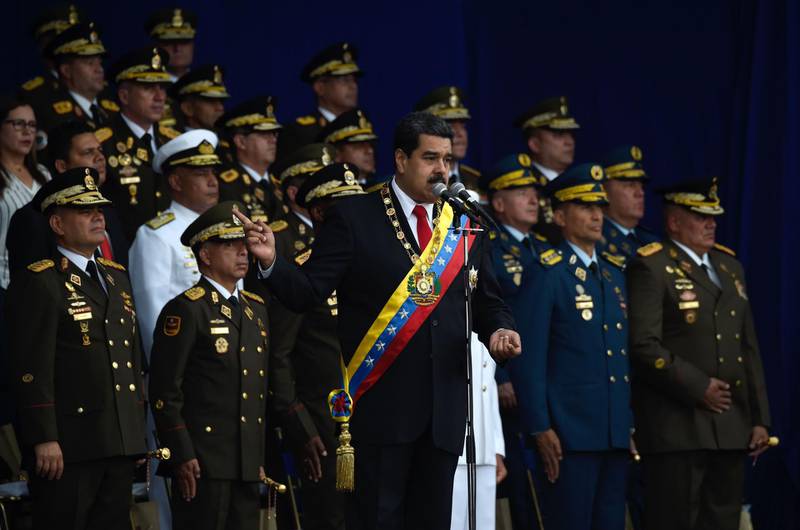 Venezuelan President Nicolas Maduro (C) delivers a speech during a ceremony in support of the National Guard in Caracas on August 4, 2018 day in which Venezuela's controversial Constituent Assembly marks its first anniversary.
The Constituent Assembly marks its first anniversary on August 4 as the embodiment of Maduro's entrenchment in power despite an economic crisis that has crippled the country's public services and destroyed its currency. The assembly's very creation last year was largely responsible for four months of street protests that left some 125 people dead.
 / AFP PHOTO / Juan BARRETO
