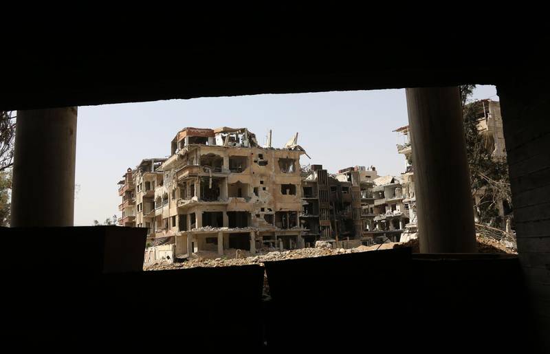 A general view shows destroyed buildings in the former rebel-held Syrian town of Douma on the outskirts of Damascus on April 19, 2018, five days after the Syrian army declared that all anti-regime forces have left Eastern Ghouta, following a blistering two month offensive on the rebel enclave. 
The regime in February launched a blistering assault on Eastern Ghouta, a semi-rural area within mortar range of central Damascus that had been in opposition hands for six years. / AFP PHOTO / STRINGER
