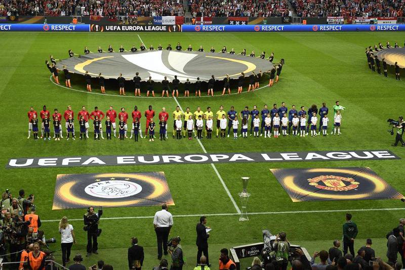The Ajax and Manchester United teams line-up ahead of kick-off. Pontus Lundahl / EPA
