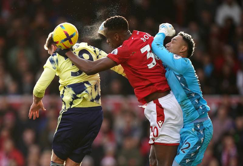 Leeds United's Maximilian Wober, left, battles for the ball with Nottingham Forest's Willy Boly and Keylor Navas. PA