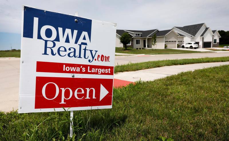 In this Wednesday, June 27, 2018, photo, an open house sign is seen on a street corner in Waukee, Iowa. On Thursday, July 5, Freddie Mac reports on the weekâ€™s average U.S. mortgage rates. (AP Photo/Charlie Neibergall)