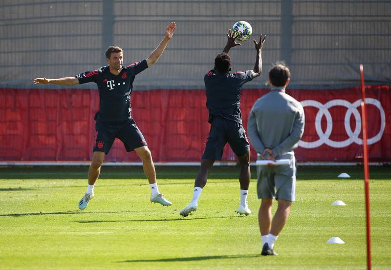 Bayern Munich's Thomas Muller, left, takes part in training as coach Niko Kovac looks on. Reuters