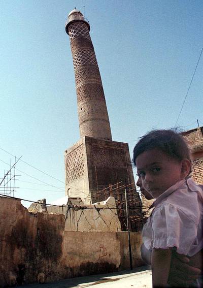 FILE - This Sept. 25, 1998 file photo shows the tilting al-Hadba minaret in Mosul, Iraq. Iraqâ€™s ministry of defense says IS destroyed the al-Nuri mosque in Mosul and the adjacent iconic leaning minaret when fighters detonated explosives inside the structures late Wednesday night on June 21, 2017. (AP Photo/Jassim Mohammed, File)