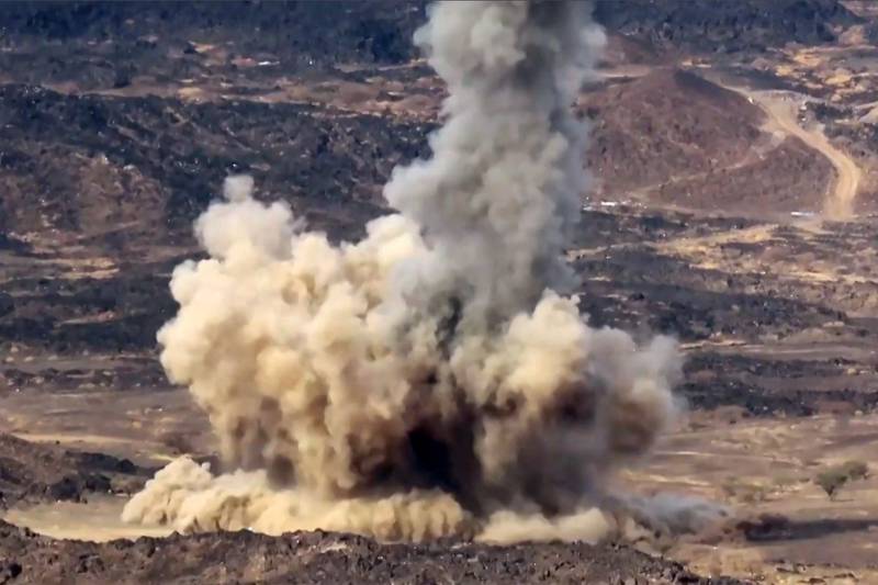 A projectile fired by fighters loyal to Yemen's government explodes near the Houthi front lines in a still from a video. Photo: AFP