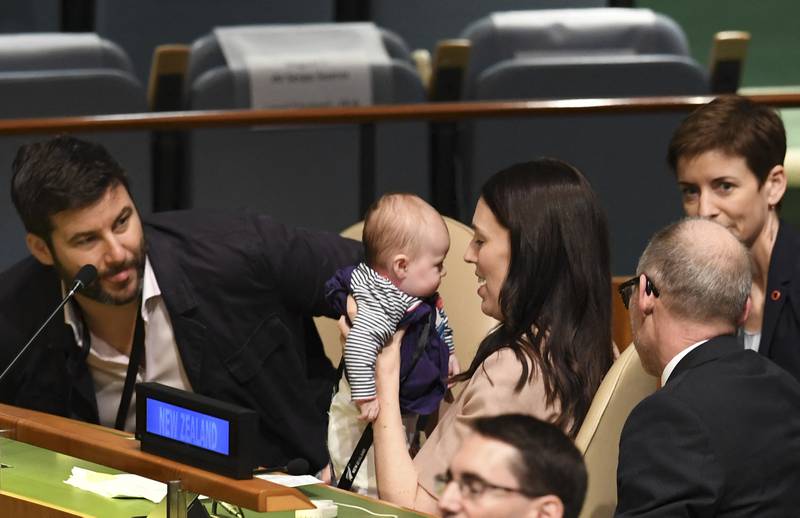 Ms Ardern holds her daughter at the Nelson Mandela Peace Summit in 2018. AFP