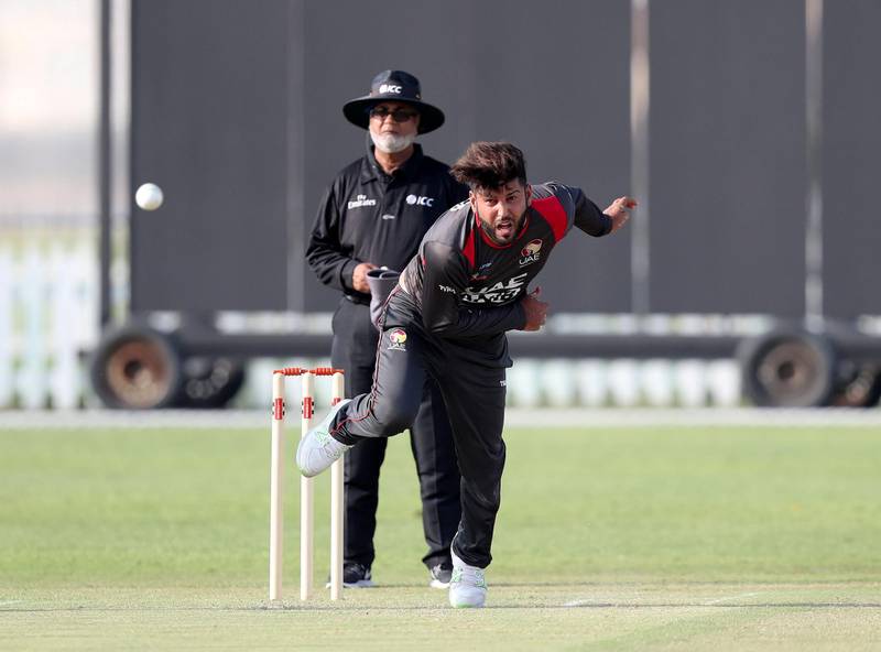Abu Dhabi, United Arab Emirates - October 22, 2018: Mohammad Naveed of the UAE bowls in the match between the UAE and Australia in a T20 international. Monday, October 22nd, 2018 at Zayed cricket stadium oval, Abu Dhabi. Chris Whiteoak / The National