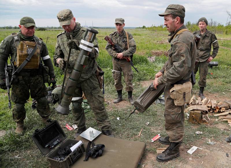 Pro-Russian troops inspect an AT4 anti-tank launcher outside the town of Svitlodarsk in the Donetsk region, Ukraine. Reuters