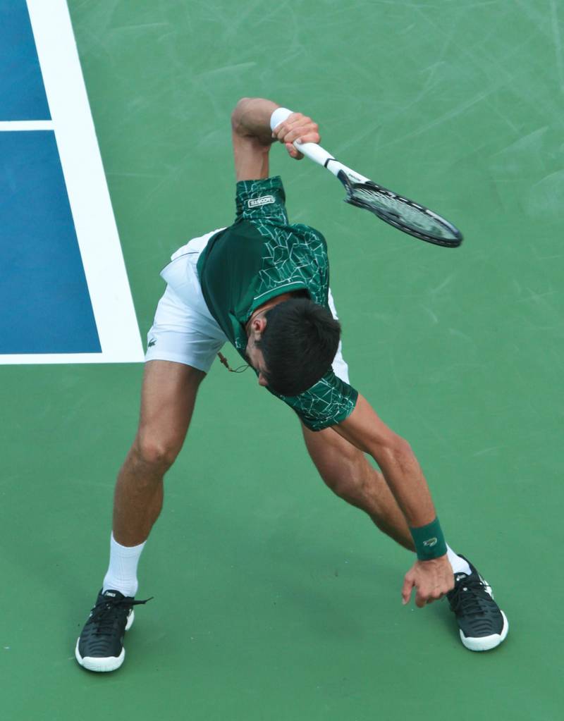 Novak Djokovic smashes his racquet after losing a game against Milos Raonic during the Western and Southern Open in 2018. EPA