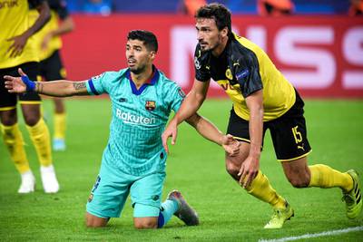 Barcelona's Luis Suarez in action against Dortmund's Mats Hummels. EPA