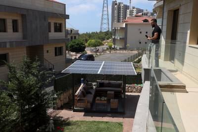 Mohammad Chehab, of the coastal town of Khaldeh, has installed a solar panel in his house to ensure uninterrupted electricity. Reuters
