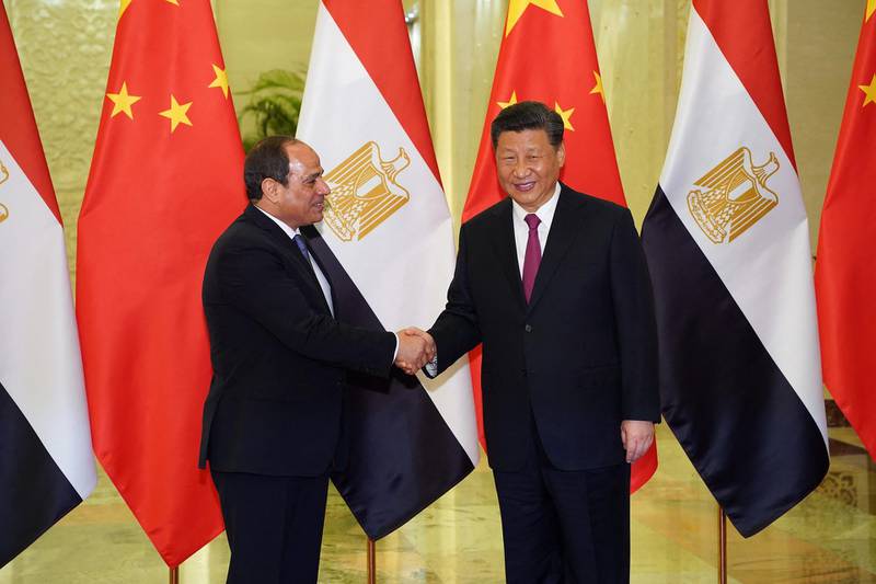 Egypt President Abdel Fattah El-Sisi (L) shakes hands with President of the People's Republic of China Xi Jinping (R) as they meet at the Great Hall of People in Beijing on April 25, 2019. - Leaders from 37 countries have been converging in Beijing for the Belt and Road Forum on April 25, hoping to grab a piece of the 1 trillion USD pie to improve their infrastructure. (Photo by Andrea VERDELLI / POOL / AFP) / “The erroneous mention[s] appearing in the metadata of this photo by Andrea VERDELLI has been modified in AFP systems in the following manner: [the Great Hall of the People ] instead of [the Diaoyutai State Guest House]. Please immediately remove the erroneous mention[s] from all your online services and delete it (them) from your servers. If you have been authorized by AFP to distribute it (them) to third parties, please ensure that the same actions are carried out by them. Failure to promptly comply with these instructions will entail liability on your part for any continued or post notification usage. Therefore we thank you very much for all your attention and prompt action. We are sorry for the inconvenience this notification may cause and remain at your disposal for any further information you may require.”