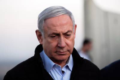 epa08022473 Israeli Prime Minister Benjamin Netanyahu  during a visit to Israeli army base in the Golan Heights located on the Israeli-Syrian border in Israel, 24 November 2019.  EPA/ATEF SAFADI / POOL