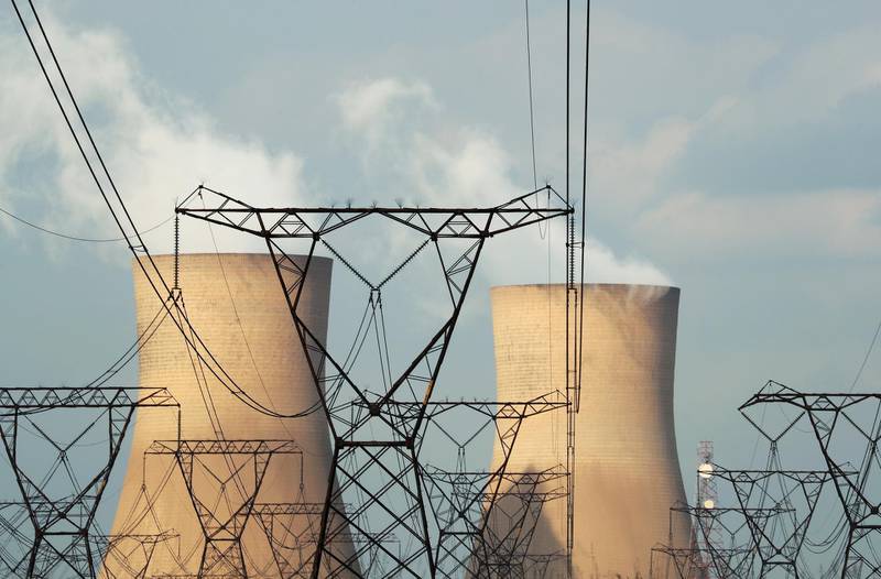 FILE PHOTO: Cooling towers are pictured at a coal-based power station owned by state power utility Eskom in Duhva, South Africa, February 18, 2020.  Picture taken February 18, 2020. REUTERS/Mike Hutchings/File Photo
