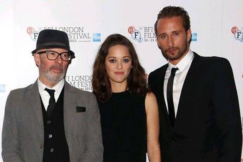 LONDON, ENGLAND - OCTOBER 13: (L-R) Filmmaker Jacques Audiard, actress Marion Cotillard and actor Matthias Schoenaerts attend the premiere of 'Rust and Bone' during the 56th BFI London Film Festival at Odeon West End on October 13, 2012 in London, England. (Photo by Tim Whitby/Getty Images for BFI)