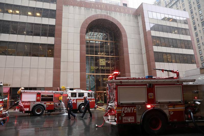 New York City Fire Department trucks are seen outside 787 7th Avenue in midtown Manhattan where a helicopter was reported to have crashed in New York City, New York. Reuters
