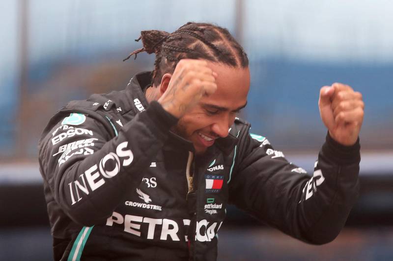 Mercedes driver Lewis Hamilton reacts after winning the 2020 Turkish Grand Prix and equalling Michael Schumacher's record of seven world titles. AP
