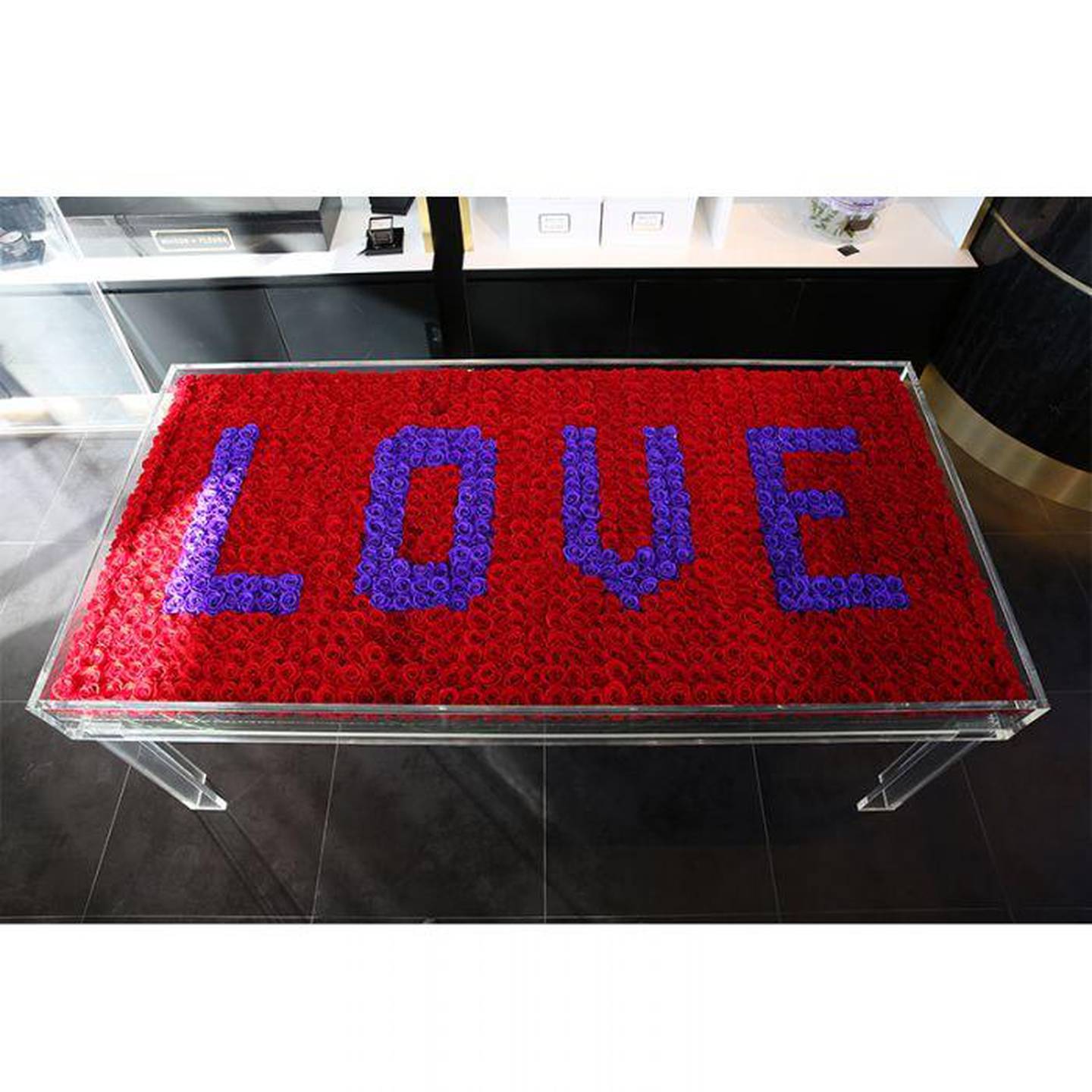 1081 long life red roses in acrylic rectangular table worth Dh71,500. Courtesy Maison Des Fleurs