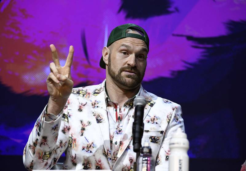 Tyson Fury flashes number two as he says he will knockout Deontay Wilder in two rounds. AFP