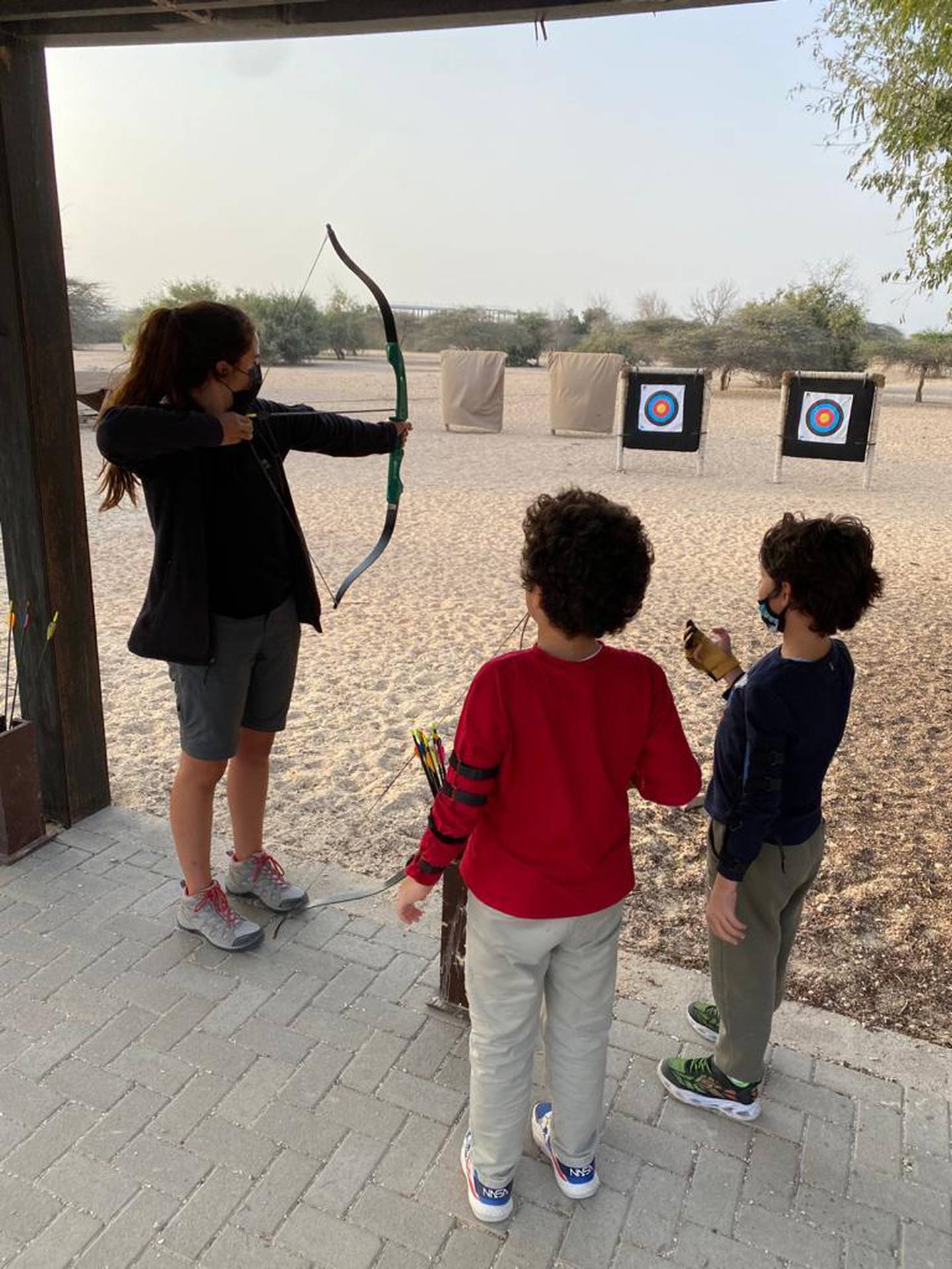 Samia Badih partakes in archery on Sir Bani Yas Island with her children. Courtesy Samia Badih