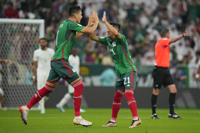 Mexico's Cesar Montes and Uriel Antuna celebrate after Henry Martin's goal. AP