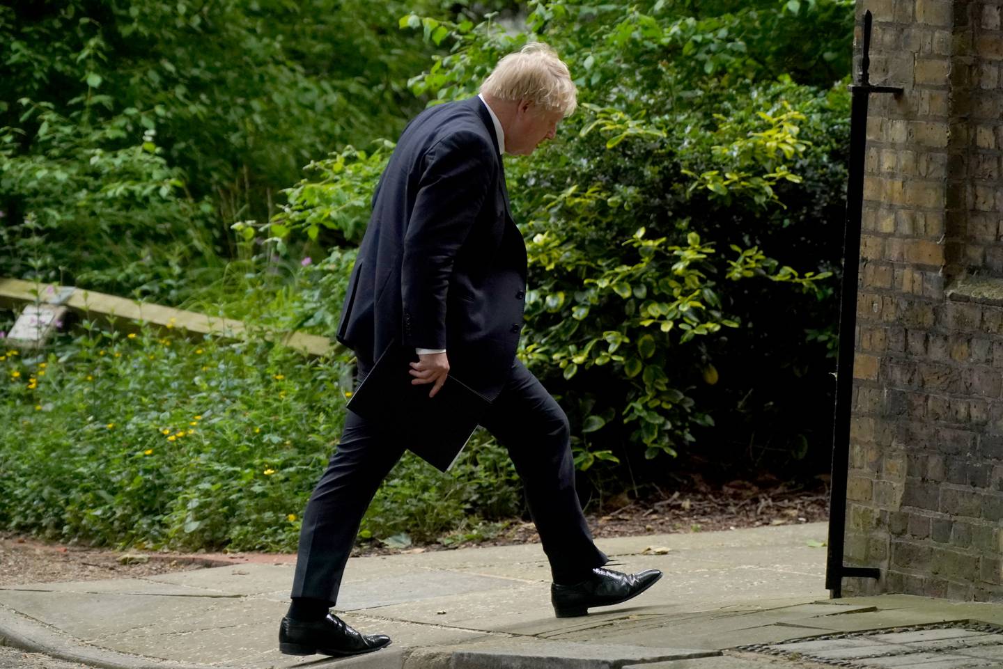 Boris Johnson heads to a press conference in Downing Street, following the publication of Sue Gray's report. PA