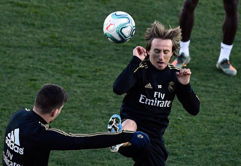 Real Madrid midfielder Luka Modric, right, during training. AFP