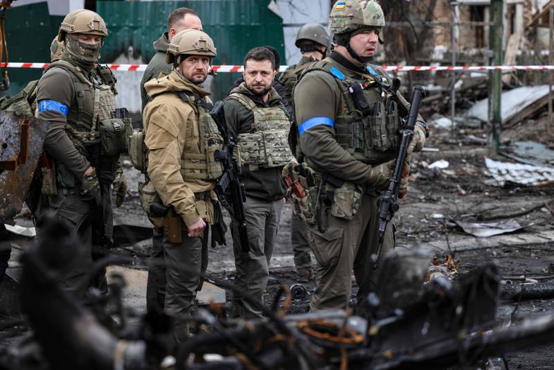 Ukrainian President Volodymyr Zelensky visits the town of Bucha after claims emerged of massacres by Russian forces there. AFP 