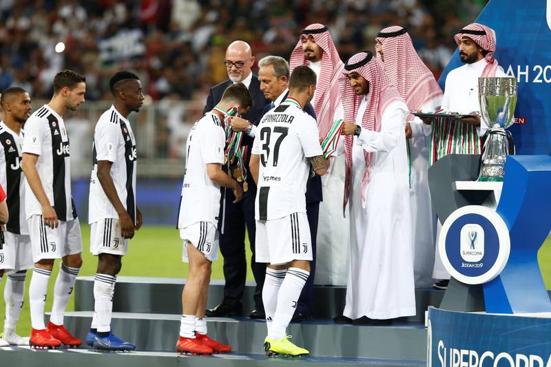 Juventus players receive their medals post match. Reuters