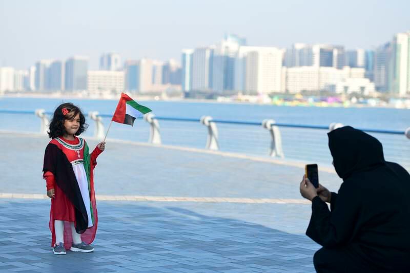 Airah Nazrin, 3, from Kerala, India dressed in colours of the UAE flag during National Day holidays at Abu Dhabi Corniche. Khushnum Bhandari / The National