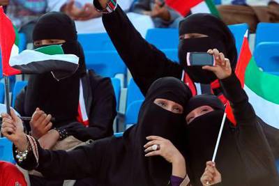 Emirati women cheer for their national team during their 20th Gulf Cup football match against Oman in the southern Yemeni city of Aden on November 26, 2010. AFP PHOTO/KARIM SAHIB
 *** Local Caption ***  749490-01-08.jpg