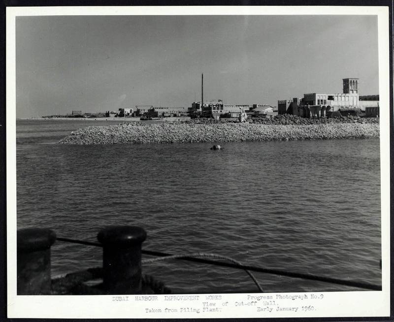 View of Dubai Creek with a traditional house with wind tower on right. Courtesy Arabian Gulf Digital Archive