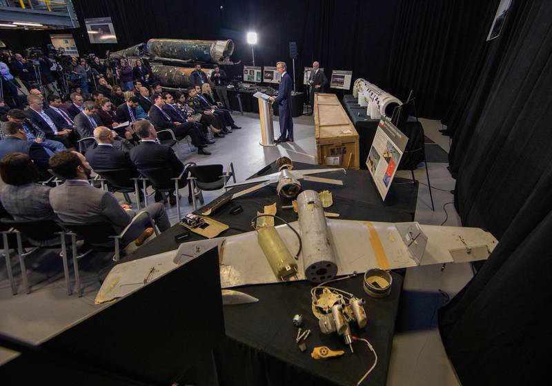 epa07197554 US Special Representative for Iran, Brian Hook (C), speaks at an 'Iranian Materiel Display' press conference in a hangar at Joint Base Anacostia-Bolling in Washington, DC, USA, 29 November 2018. Hook is speaking among what are said to be recovered Iranian weapons.  EPA/ERIK S. LESSER