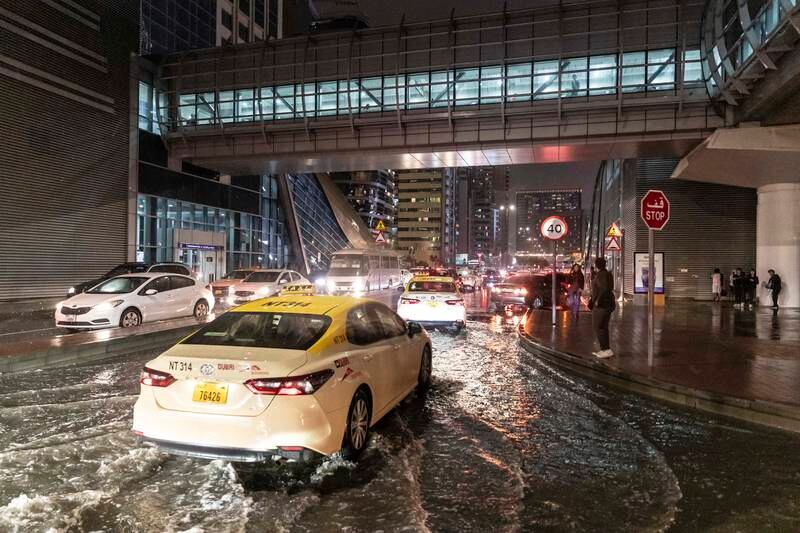 Cars drive through the rain in Dubai. Antonie Robertson / The National


