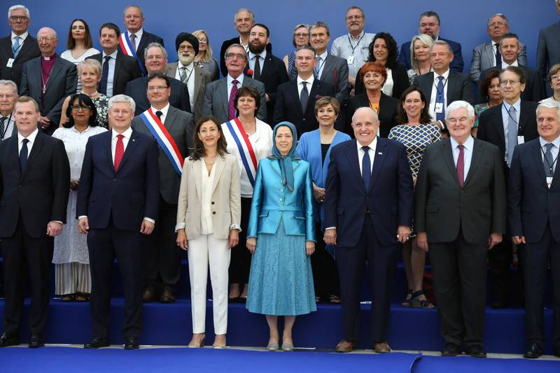 (L-R, front row) Canadian foreign minister John Baird, Canadian retired politician Stephen Joseph, Colombian-French politician and former senator Ingrid Betancourt, leader of the People's Mujahedin of Iran Maryam Rajavi, former US mayor of New York City and attorney to President Donald Trump Rudolph Giuliani, former US Speaker of the House Newt Gingrich,  US author and Chairman of the Center for Equal Opportunity Linda Chavez (2nd row, 3rd R),  Italy's former Foreign Affairs Minister Giulio Terzi di Sant'Agata (2nd row, R) pose for a picture during the meeting "Free Iran 2018 - the Alternative", organised by the People's Mujahedin of Iran in Villepinte, near Paris on June 30, 2018. (Photo by Zakaria ABDELKAFI / AFP)