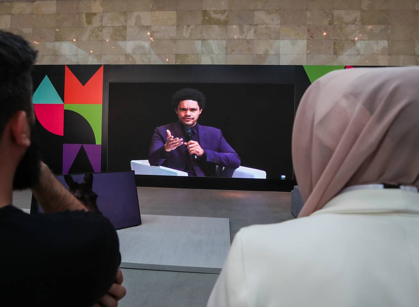 The audience watches a keynote conversation with Trevor Noah on the screen at Culture Summit Abu Dhabi. Victor Besa / The National