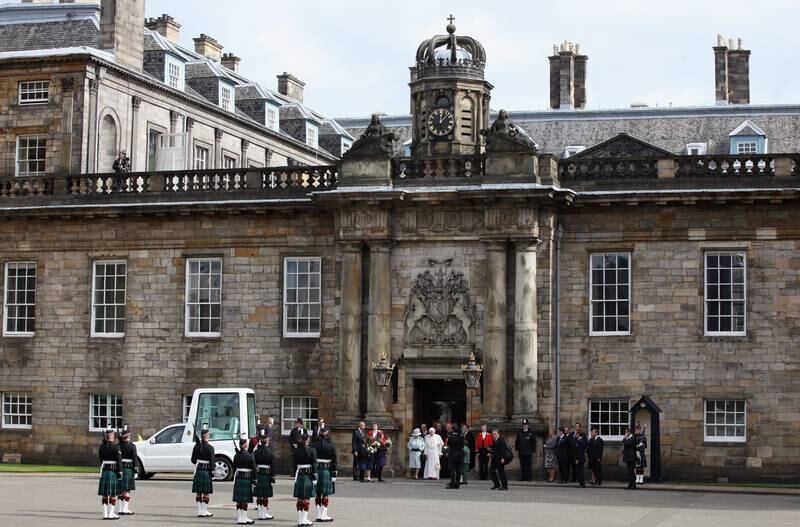 Queen Elizabeth and Pope Benedict XVI leave the Palace of Holyroodhouse, the Queen's official residence in Scotland, after a visit by the pope in 2010.