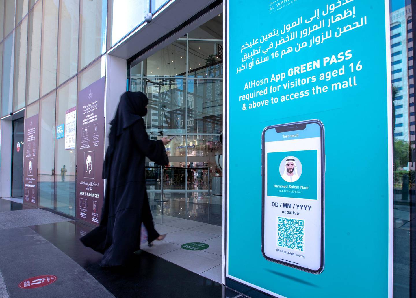 Al Hosn Green Pass awareness signages are put up at the Al Wahda Mall, Abu Dhabi on June 14th, 2021. The new Covid-19 restrictions start tomorrow. Victor Besa / The National.