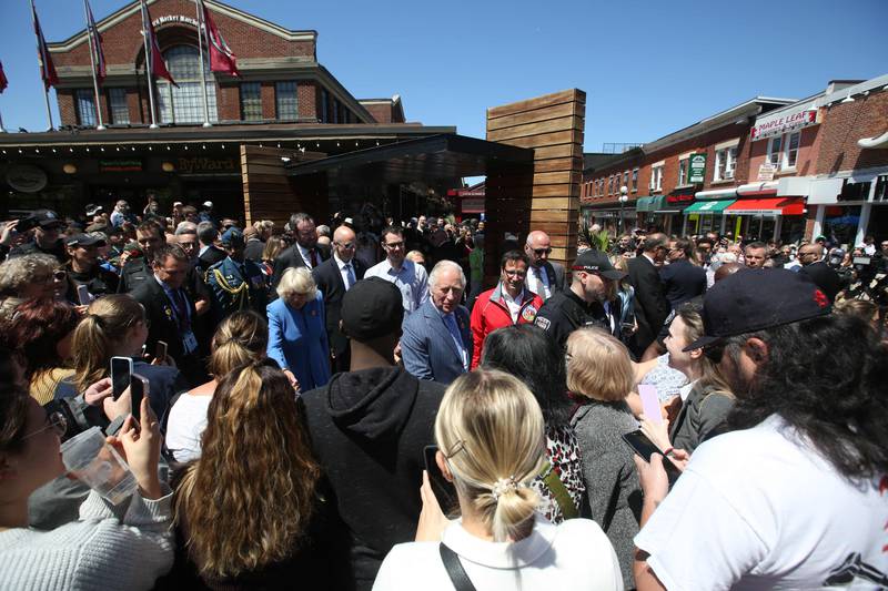 Britain's Prince Charles and Camilla Duchess of Cornwall greet well-wishers at ByWard Market on May 18, 2022 in Ottawa. AFP