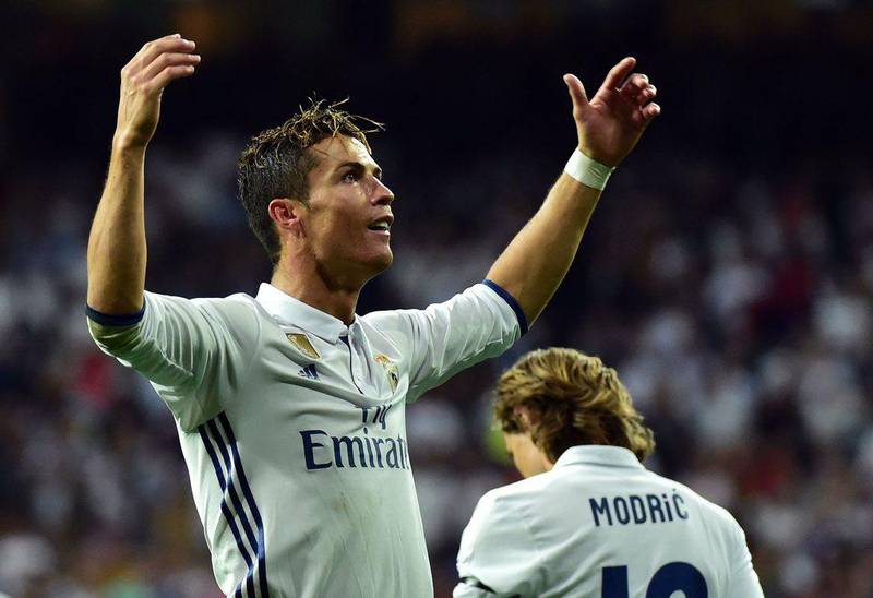 Real Madrid's Cristiano Ronaldo celebrates after scoring one of his two goals against Sevilla at the Santiago Bernabeu stadium in Madrid on May 14, 2017. Real Madrid won 4-1. Gerard Julien / AFP
