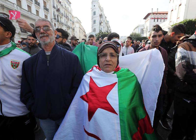 Algerians chant slogans during a protest rally in Algiers, Algeria. Thousands of people have taken to the streets in the capital Algiers calling for a mass boycott of the country's presidential elections, which is taking place on the day, and to voice against the five candidates running to replace ousted president Abdelaziz Bouteflika for being closely linked to the former regime.  EPA