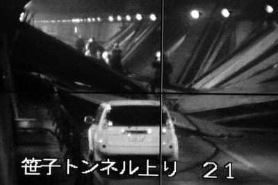 This image taken from the monitoring camera of Central Nippon Expressway's Hachioji branch, Tokyo, shows the fallen roof panels in the Sasago Tunnel, Yamanashi Prefecture, central Japan. AP Photo/Kyodo News.