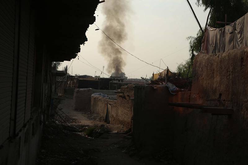 Smoke billows from a prison after a militant attack in Jalalabad, Afghanistan.  EPA