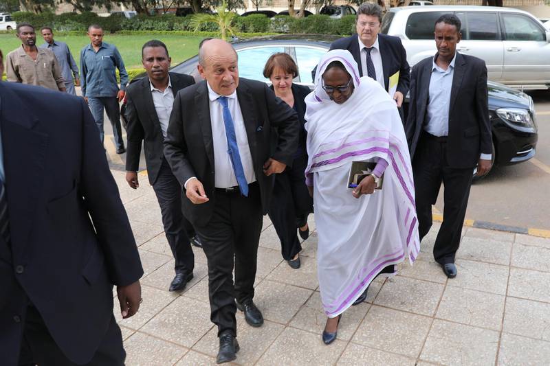 epa07846779 French Foreign Minister Jean-Yves Le Drian (C-L) and Sudanese Foreign Minister Asma Mohamed Abdalla (C-R) arrive for a meeting in Khartoum, Sudan, 16 September 2019. Le Drian arrived in Khartoum for meetings with Sudanese officials to show support for the new government and discuss means of support during the transitional period.  EPA/MARWAN ALI