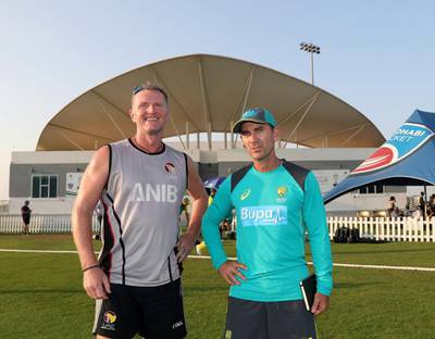 Abu Dhabi, United Arab Emirates - October 22, 2018: Head coaches Dougie Brown of UAE and Justin Langer Australia at the end of the match between the UAE and Australia in a T20 international. Monday, October 22nd, 2018 at Zayed cricket stadium oval, Abu Dhabi. Chris Whiteoak / The National