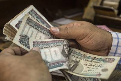 Analysts forecast the Egyptian pound to reach up to 21 to the US dollar by the end of this year. AFP